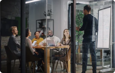 BEND team sitting down in room discussing client project