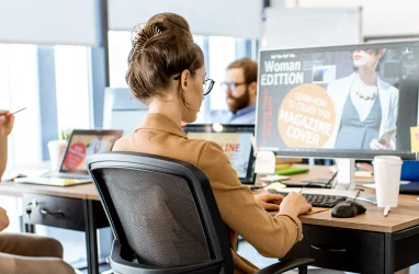 BEND web designer designing website on desktop computer